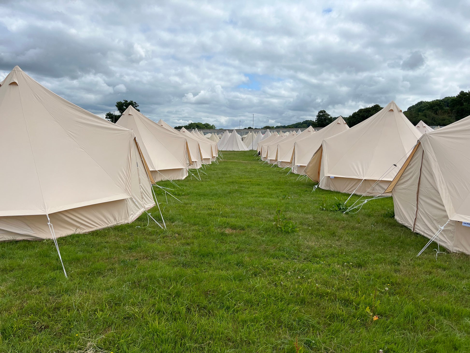 Row of 5m Bell Tents when set up for hire.